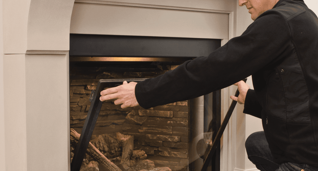 Man Installing Gas Fireplace Window